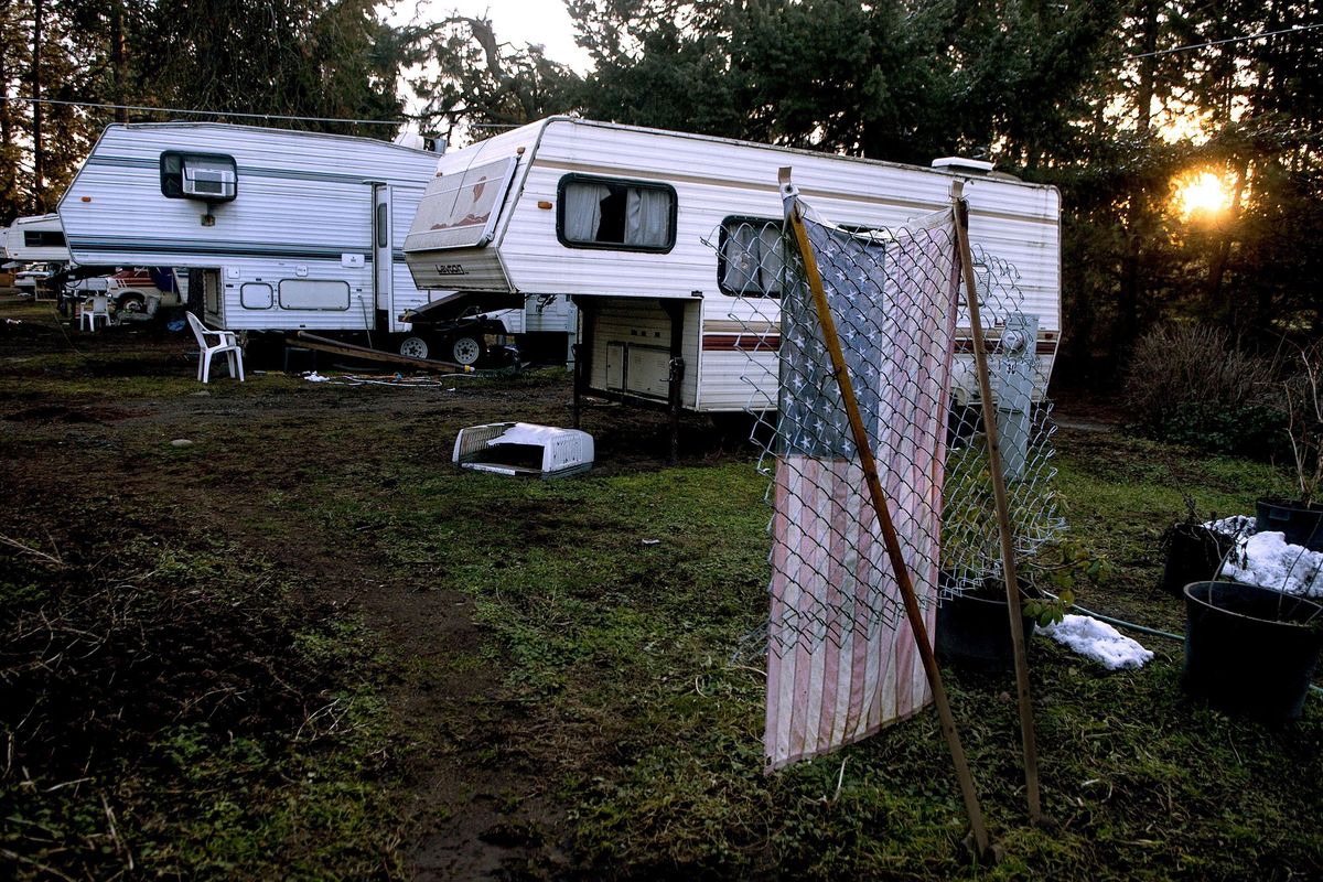 The sun sets Tuesday at the Cedar Motel and RV Park in Coeur d’Alene. Residents there will have to move out by May 1. Hagadone Hospitality Co. bought the 2.3-acre property in November and plans to clear the site, located near the entrance to the Coeur d’Alene Resort Golf Course, and clean up failing septic systems serving the RV park and motel. (Kathy Plonka / The Spokesman-Review)