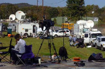 
Media outlets, from networks to newspapers, stake out the entrance to the Alderson Prison Camp in Alderson, W.Va.
 (Associated Press / The Spokesman-Review)