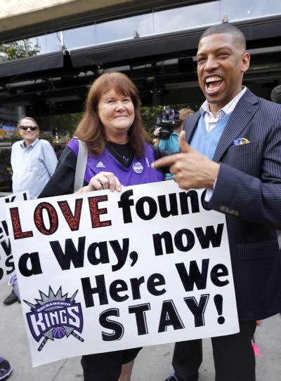 Sacramento Mayor Kevin Johnson joins delighted Kings fans at a rally. (Associated Press)