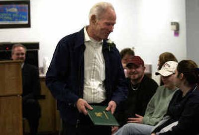 
Edwin Littlejohn, a Korean War veteran, received his high school diploma Tuesday night at the East Valley school board meeting. Littlejohn's family and friends filled the room to witness this honor. 
 (Liz Kishimoto / The Spokesman-Review)
