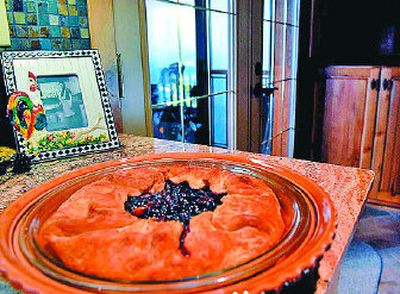 Sally Slankard's homemade huckleberry pie awaits the cutting of the first piece.
(The Spokesman-Review)