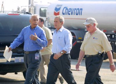 
Jeet Bindra and President Bush tour the Chevron Pascagoula Refinery on Thursday in Mississippi.
 (Associated Press / The Spokesman-Review)