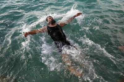 Former Guantanamo detainee Salahidin Abdulahat swims  near Hamilton, Bermuda, on Sunday.  (Associated Press / The Spokesman-Review)