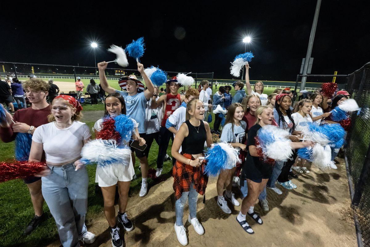 Central Valley students cheer on the Bears girls slow pitch softball team during their game Tuesday with University High School.  (COLIN MULVANY/THE SPOKESMAN-REVIEW)