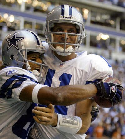
 Cowboys wide receiver Terry Glenn, left, and quarterback Drew Bledsoe celebrate a 38-yard touchdown pass during the first quarter against the Eagles. It was the second touchdown Bledsoe and Glenn connected for in the quarter. 
 (Associated Press / The Spokesman-Review)