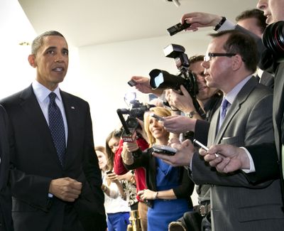 President Barack Obama turns to reporters as he leaves Capitol Hill in Washington on Wednesday. (Associated Press)