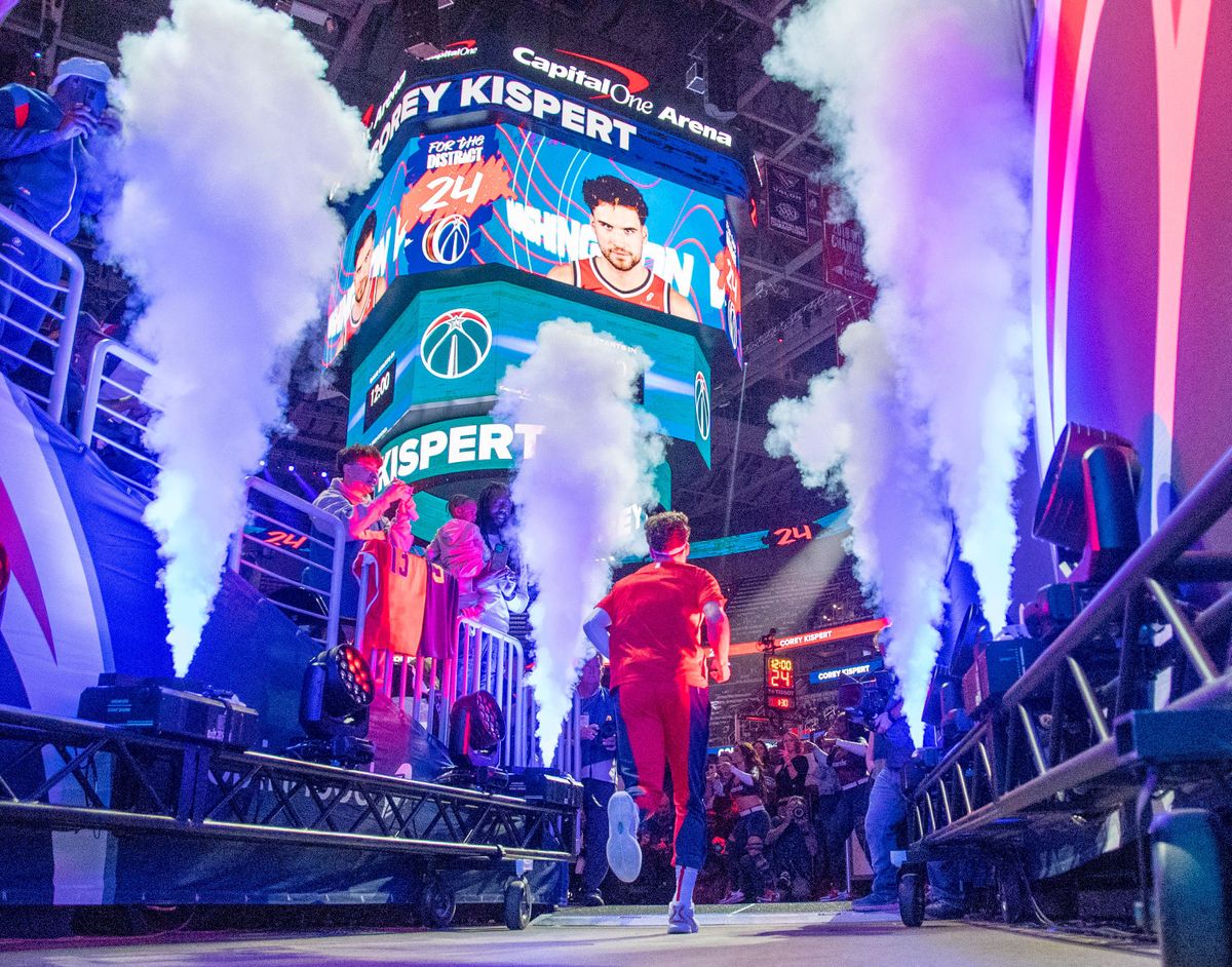 Washington Wizards forward Corey Kispert (24) runs onto the court for player introductions on home opening night against the Memphis Grizzlies at Capital One Arena on October 28, 2023.   (Jonathan Newton/Washington Post)