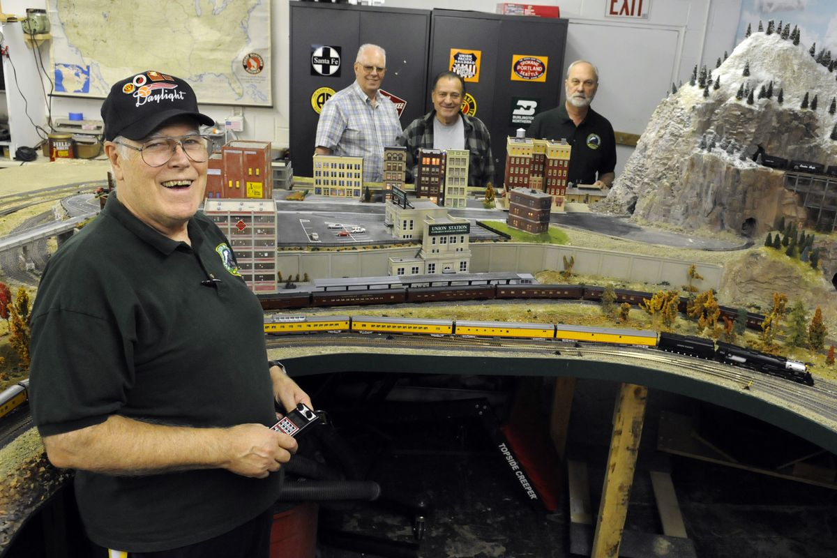 Evergreen Railroad Modelers vice president Mike Baker marvels at part of the impressive HO layout the club has been creating for the past three years. (J. Bart Rayniak)