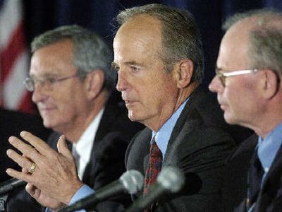 
Former baseball commissioner Peter Ueberroth, center, speaks during a news conference. 
 (Associated Press / The Spokesman-Review)