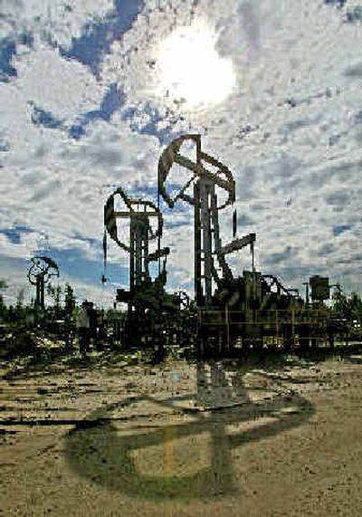 
A giant Yukos oil rig is seen near Tyumen, in Western Siberia. 
 (Associated Press / The Spokesman-Review)