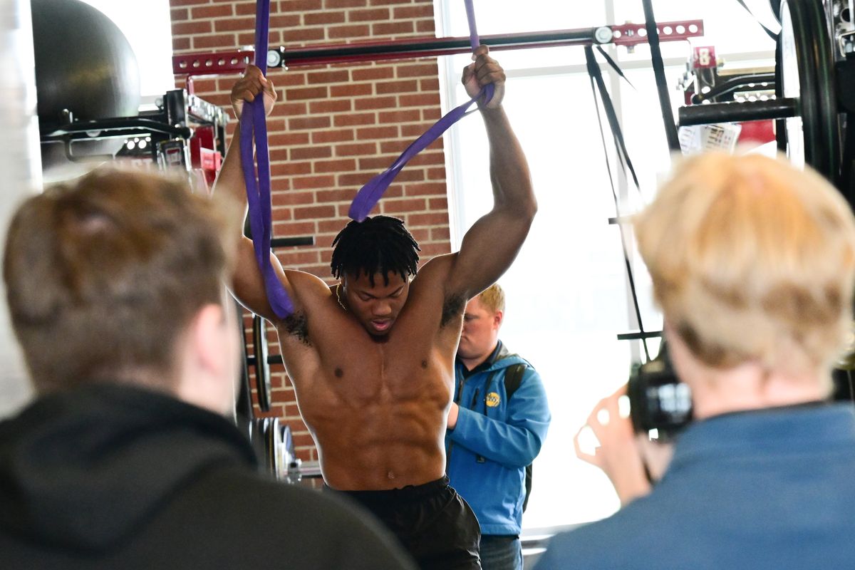 WSU linebacker Daiyan Henley warms up as media members film during WSU’s NFL Pro Day on Tuesday, March 28, 2023, at WSU’s Football Complex in Pullman, Wash.  (Tyler Tjomsland/The Spokesman-Review)