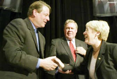 Al Gore, left, greets Sen. Patty Murray, right, during the Democratic State Convention Gala Banquet honoring U.S. Rep. Norm Dicks, center, Friday in Tacoma.
(Associated Press / The Spokesman-Review)