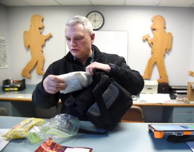 Spokane Assistant Fire Chief Brian Schaeffer shows the small satchel of baby essentials kept at the front desk of area of a Spokane Fire station Monday, Feb. 1, 2016. A newborn baby was dropped at Station 8 on Monday and was transferred to the hospital for more observation. (Jesse Tinsley / The Spokesman-Review)