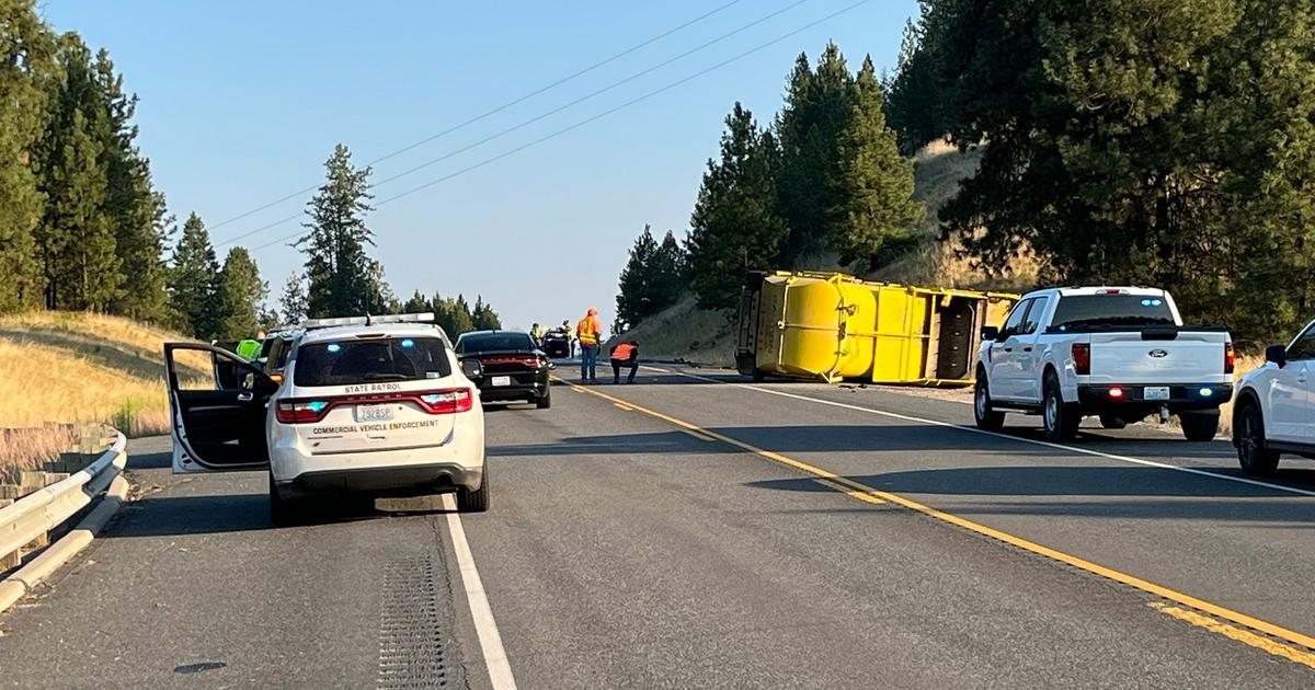 Two dead in head-on collision with garbage truck