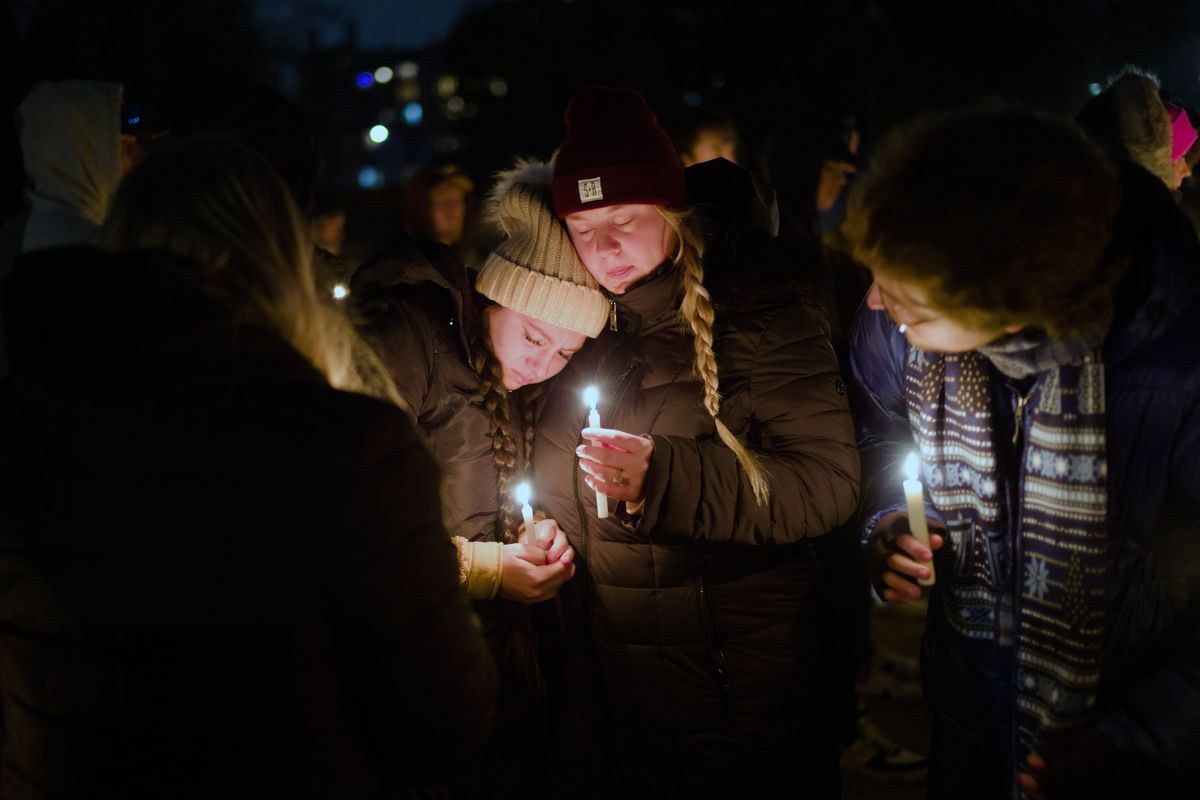 Mourners hold a candlelight vigil in Coeur d