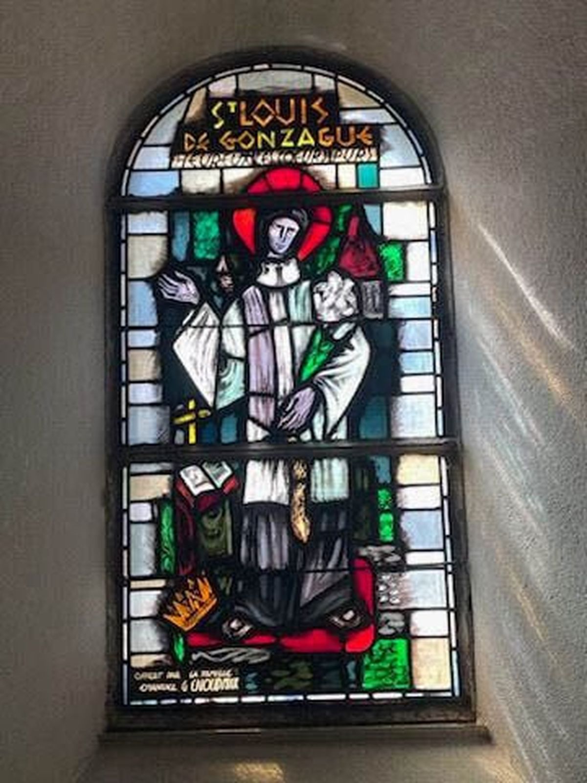 This stained glass window in a church in Bourg-Saint-Pierre shows Aloysuis Gonzaga, also known as St. Louis de Gonzague.  (Courtesy of Joseph Harrington)