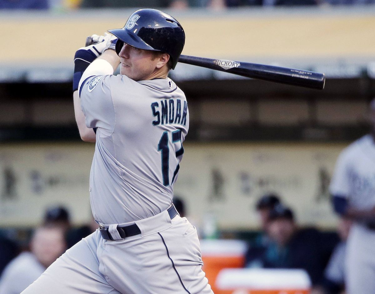 Seattle’s Justin Smoak doubles home first-inning run. (Associated Press)