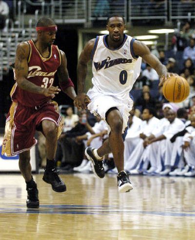 
Washington's Gilbert Arenas dribbles around former teammate Larry Hughes, now with Cleveland, during a preseason game this month. 
 (Associated Press / The Spokesman-Review)