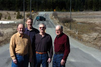 
From left, Dick Edinger, John Pankratz, Jimmie Dorsey and Leonard Lehtola of the East Side Highway District stand on Mullan Trail Road, scheduled for a sealing project. They announced Tuesday that the district will ask for a vote May 23 in favor of an increase in the levy to fund the highway district. Because of the increase in traffic usage, roads are being damaged at a higher rate. 
 (Jesse Tinsley / The Spokesman-Review)