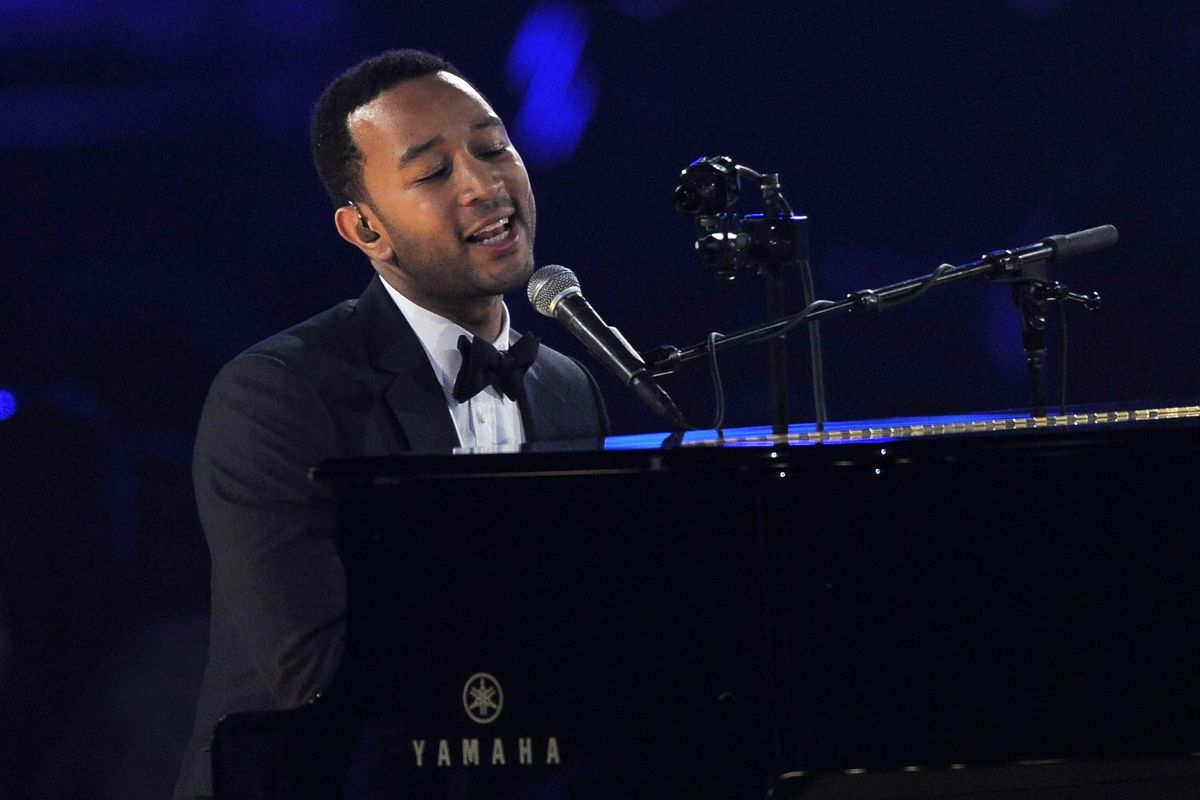 John Legend, pictured in 2013, will team with Ariana Grande to record the theme to Disney’s live-action “Beauty and the Beast” remake. Beauty and the Beast, starring Emma Watson and Dan Stevens, will be released March 17. (Chris Pizzello / Invision/AP)