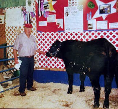 
In 2002, Lawrence Mietzner sold three steers to 4-H kids to raise for the fair. He was especially proud that this one took Champion.
 (The Spokesman-Review)