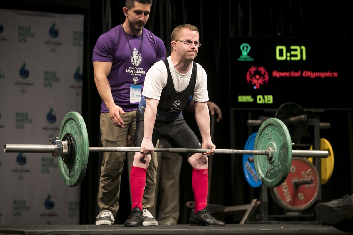 Jon Fisher, of Spokane, competes in powerlifting with a 52.5-kilogram deadlift  at the Special Olympics USA Games at the University of Washington’s Meany Hall  on July 2, 2018. (Bettina Hansen / The Seattle Times)
