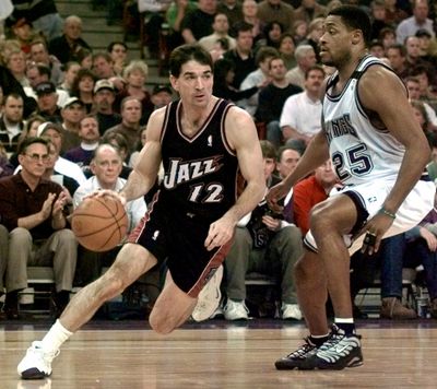 In this Jan. 22, 2000 photo, Utah Jazz guard John Stockton, left, drives to the basket past Sacramento Kings guard Nick Anderson during the first quarter of an NBA Basketball game in Sacramento, Calif.  (Associated Press)