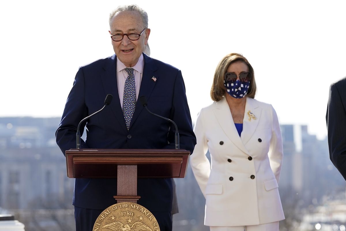 Senate Majority Leader Chuck Schumer of N.Y., speaks as House Speaker Nancy Pelosi of Calif., holds an enrollment ceremony for the $1.9 trillion COVID-19 relief bill last Wednesday, March 10, 2021, in Washington.  (Alex Brandon)