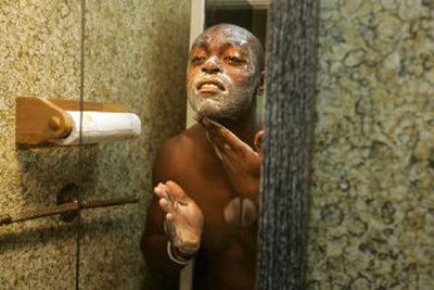 
Former professional football player Fred Barnett uses a honey and almond facial scrub by Syence at his mother-in-law's house in Wyncote, Pa. 
 (Associated Press / The Spokesman-Review)