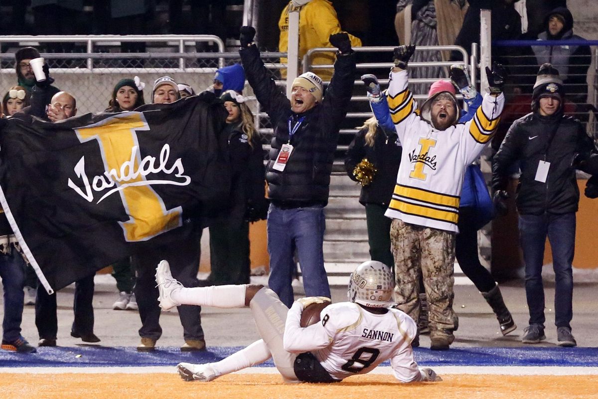 Idaho wide receiver Jacob Sannon (8) slides across the end zone after scoring a touchdown during the second half of the Famous Idaho Potato Bowl game against Colorado State in Boise on Thursday. (Otto Kitsinger / Associated Press)