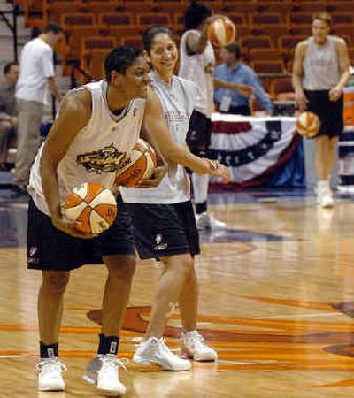 
Storm players Catrina Frierson , left, and Michelle Greco share a smile during practice Thursday. 
 (Associated Press / The Spokesman-Review)