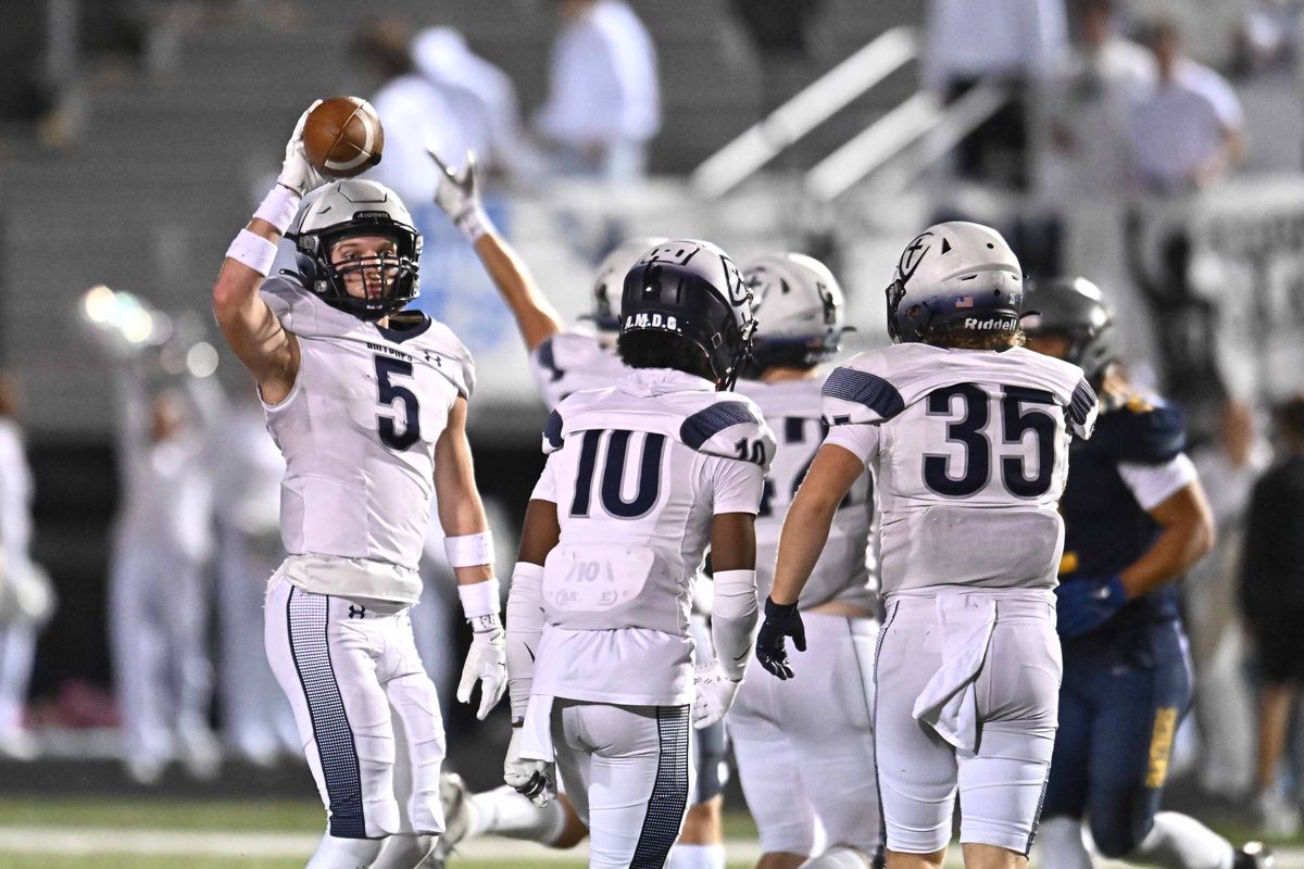 Gonzaga Prep defensive back Jack Pierce, left, celebrates after a Mead turnover on Oct. 24. G-Prep won 31-23.  (James Snook)