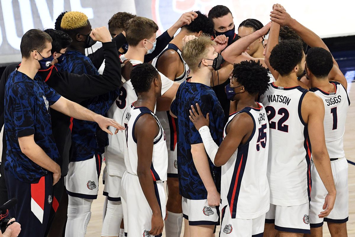The Zags circle up on center court after defeating the Santa Clara Broncos 89-75 during a college basketball game, Thursday, Feb. 25, 2021, in the McCarthey Athletic Center.  (Colin Mulvany/THE SPOKESMAN-REVIEW)