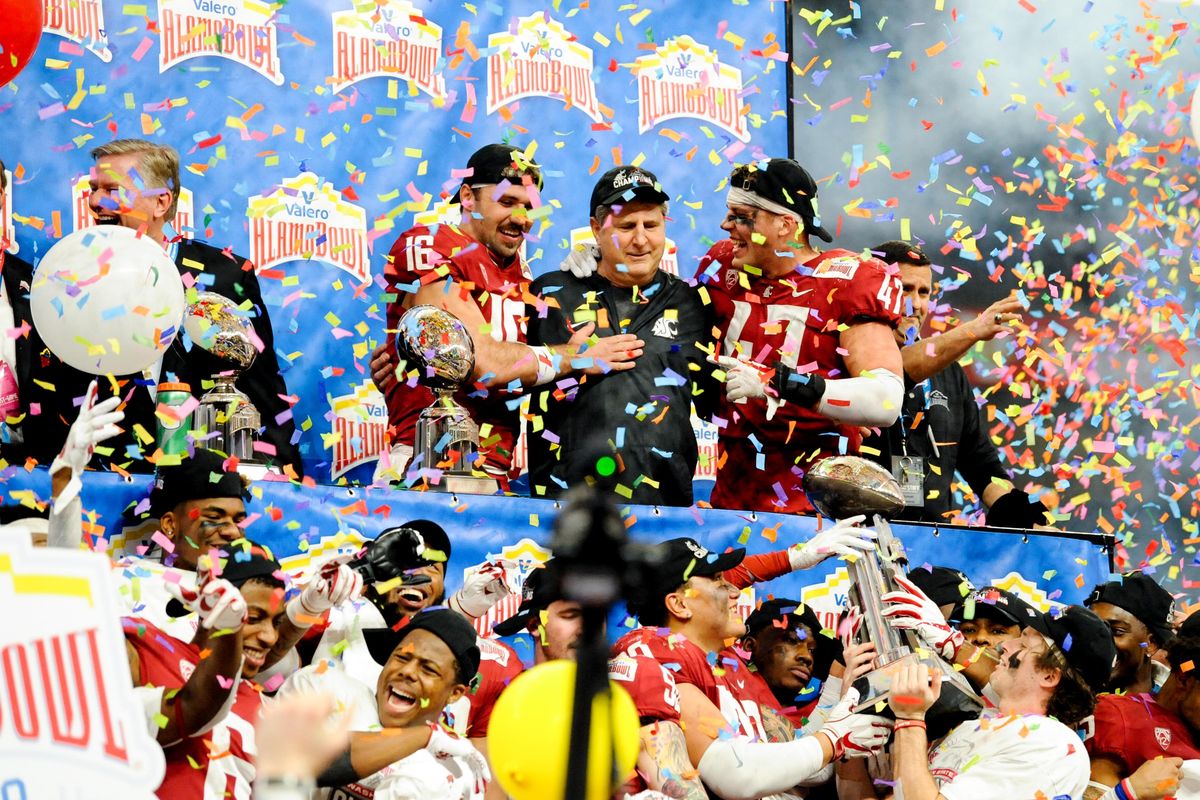 Washington State celebrates after defeating the Iowa State Cyclones during the second half of the 2018 Alamo Bowl on Friday, December 28, 2018, at the Alamo Dome in San Antonio, TX. WSU won the game 28-26. (Tyler Tjomsland / The Spokesman-Review)