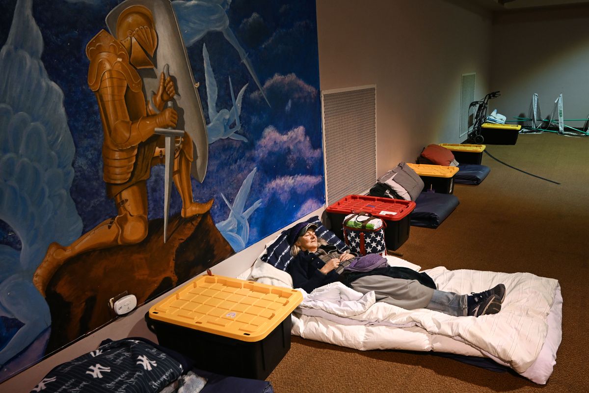 Carol Lewis settles in for the night Thursday at the Knox Women’s Shelter in the basement of the Knox Presbyterian Church. (COLIN MULVANY/THE SPOKESMAN-REVIEW)