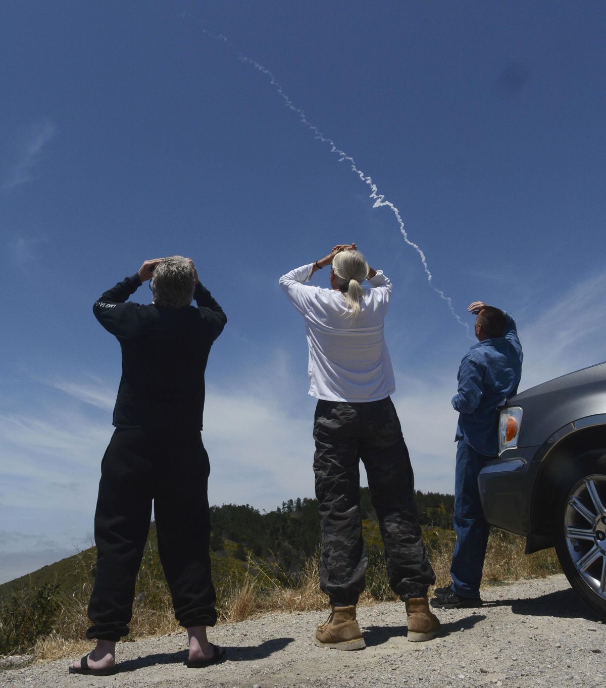 From Harris Grade Road north of Lompoc, Calif., spectators watch an interceptor missile launch from an underground silo at Vandenberg Air Force Base, and fly toward an intercontinental-range missile fired from a test range on Kwajalein Atoll in the Pacific. Hit or miss, the Pentagon