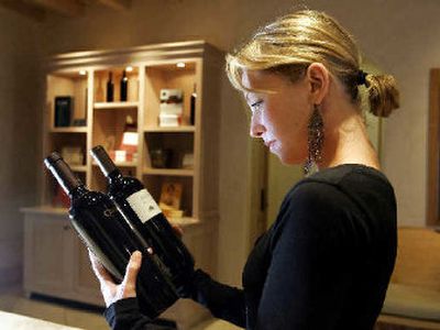 
Jenny Turnbull, owner of The Placement Agency, looks over a pair of bottles at the Cardinale winery in Napa, Calif. Picking the right wine for a scene requires close attention, says Turnbull, who spent 10 years with FOX, most recently doing product placement for 20th Century Fox, before founding her own business. 
 (Associated Press / The Spokesman-Review)
