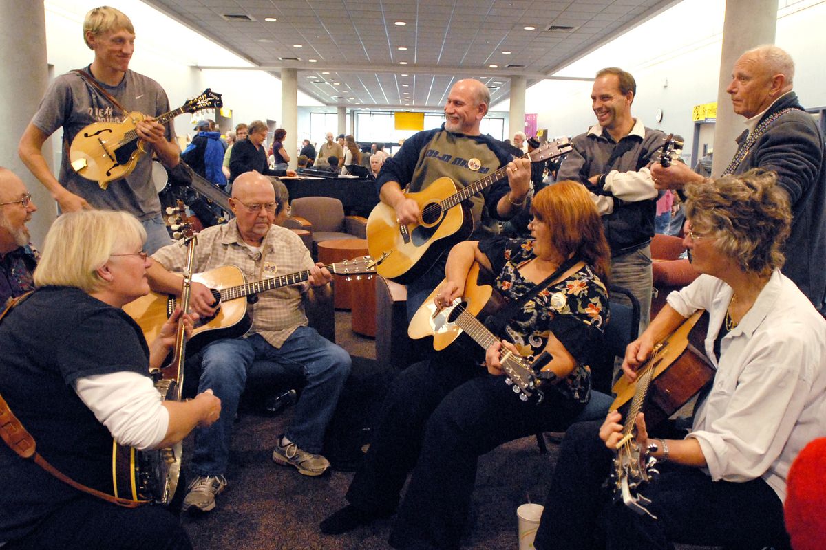 Bluegrass jammers gather in circles in the hallways of the Spokane Community College Lair Building and play songs they all know at the Fall Folk Festival in November of 2008. The annual free festival is put on by the Spokane Folklore Society. (File photos)