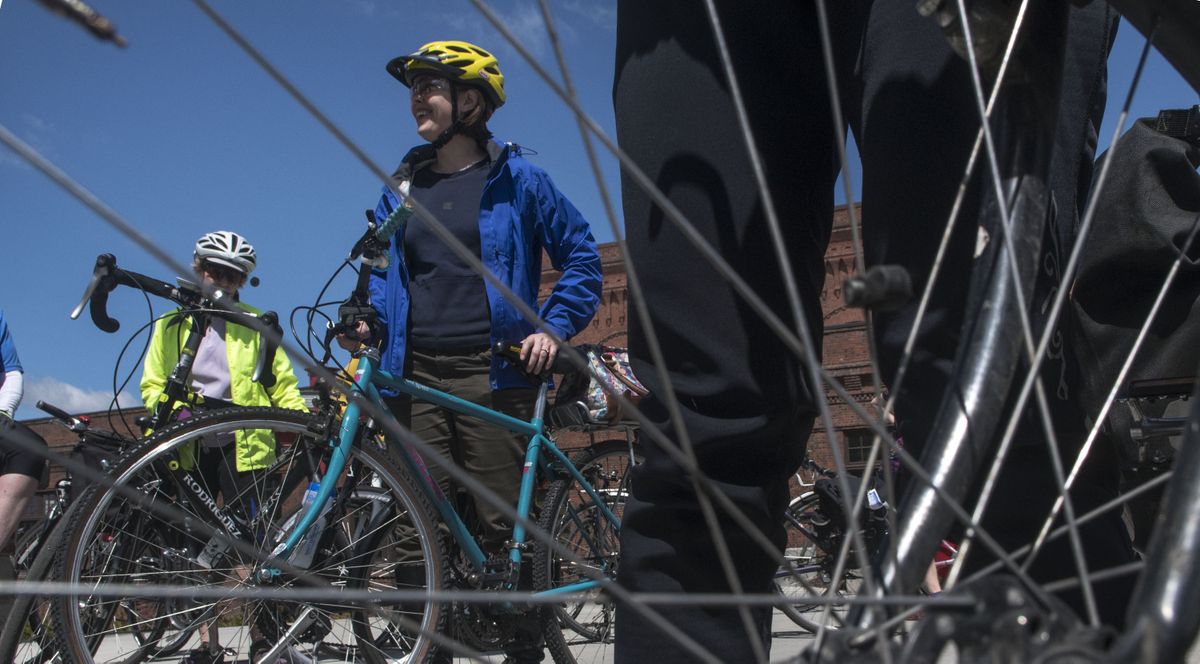 City of Spokane Bike Advisory Board member Melissa Mohr, center prepares to take off from downtown to tour bike lanes and trails in Spokane on Friday, May 11, 2018.  (Kathy Plonka / The Spokesman-Review)