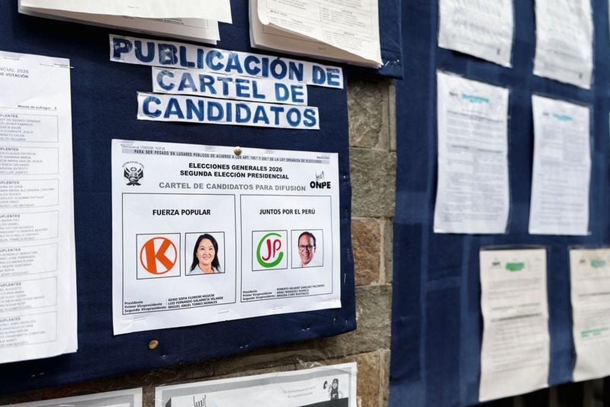 A poster featuring presidential candidates is displayed at a polling station ahead of the Sunday runoff election in Lima, Peru.   (Reuters )