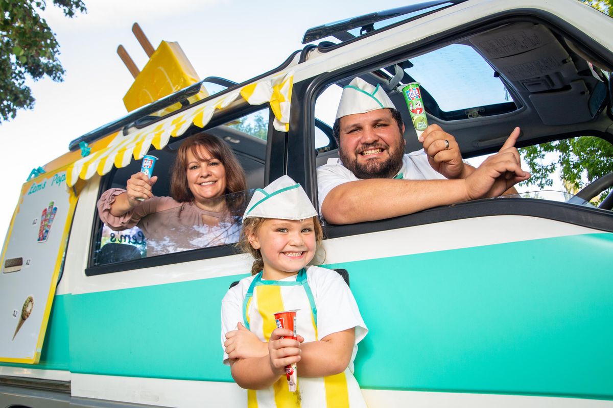 Sarah Welliver, Lemyn Welliver and Chauncy Welliver pose for a photo with their Lem’s Pops ice cream truck in Franklin Park on Sept. 3, 2019. The family got the business up and running last week: Chauncy is Pops and drives the truck; Lemyn serves the treats and makes creative decisions; and Sarah is the business manager who has the final say on executive decisions. (Libby Kamrowski / The Spokesman-Review)