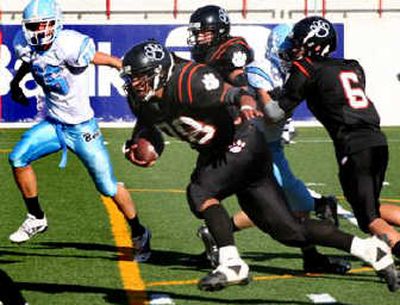
Lewis and Clark High School's Alex Shaw gains yards in a win over Central Valley earlier this year. Photo courtesy of Lewis and Clark High
 (Photo courtesy of Lewis and Clark High / The Spokesman-Review)