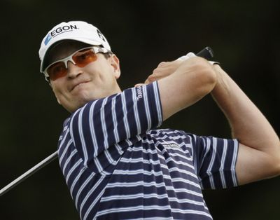 Zach Johnson watches his tee shot on the 18th hole during the third round of the Texas Open. He shot 60 on Saturday, matching the course record. (Associated Press / The Spokesman-Review)