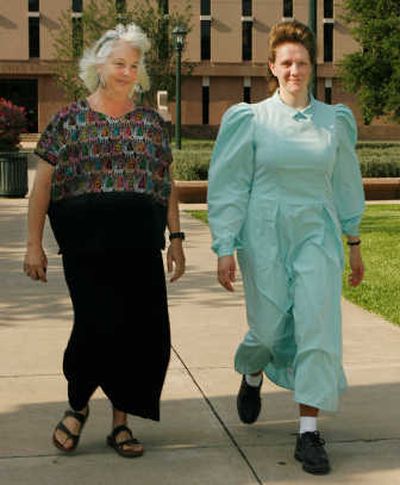 
Martha Emack, right, one of the parents from the Yearning For Zion Ranch at Eldorado, Texas, is escorted to a news conference in Austin, Texas, on Thursday by attorney D'Ann Johnson. Associated Press
 (Associated Press / The Spokesman-Review)