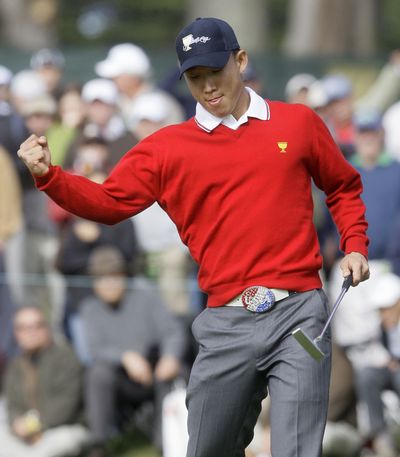 U.S. player Anthony Kim celebrates his match-winning birdie putt.  (Associated Press / The Spokesman-Review)