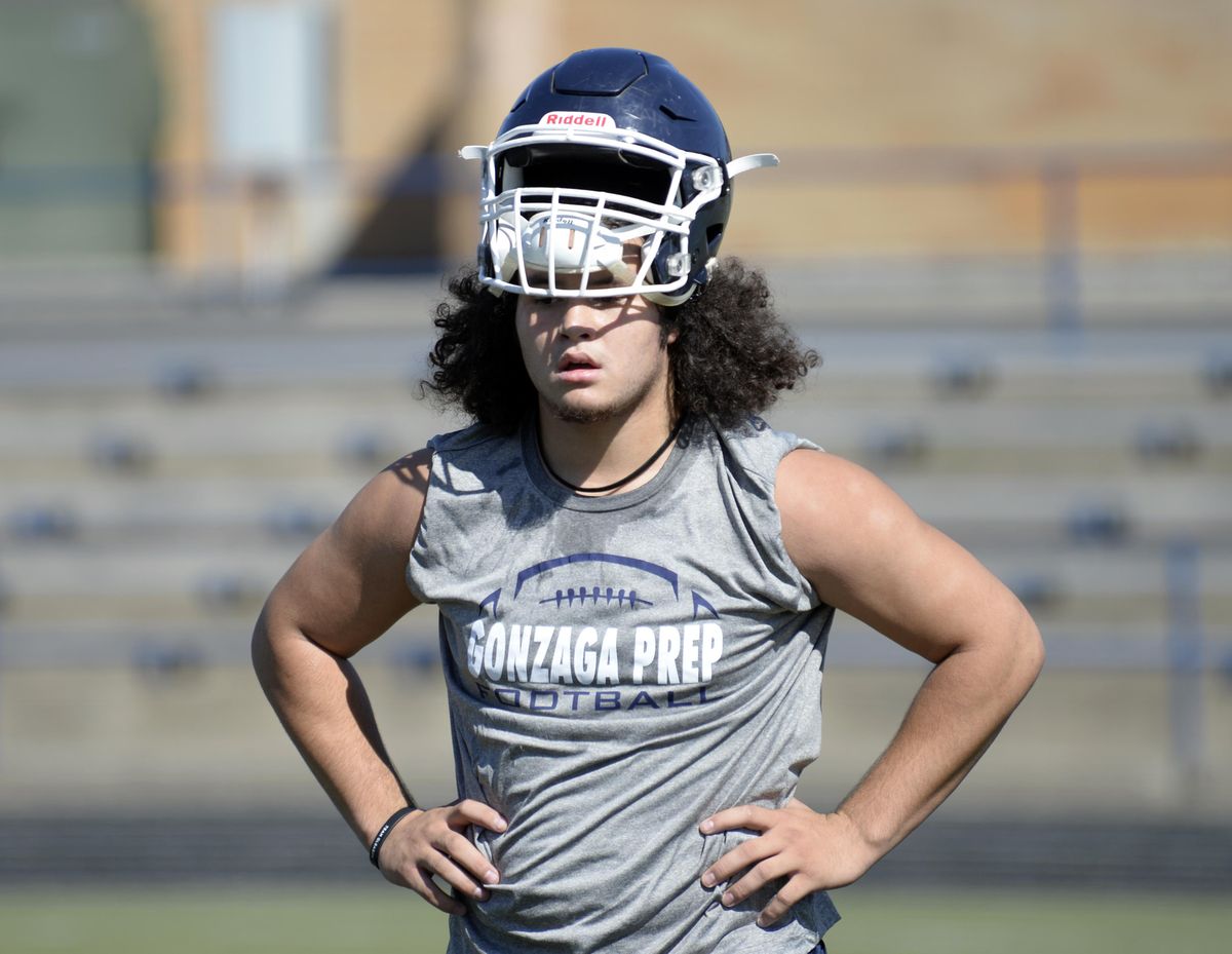 Taj Hoard watches his teammates work on drills on the first day of practice on Aug. 17. (Jesse Tinsley / The Spokesman-Review)