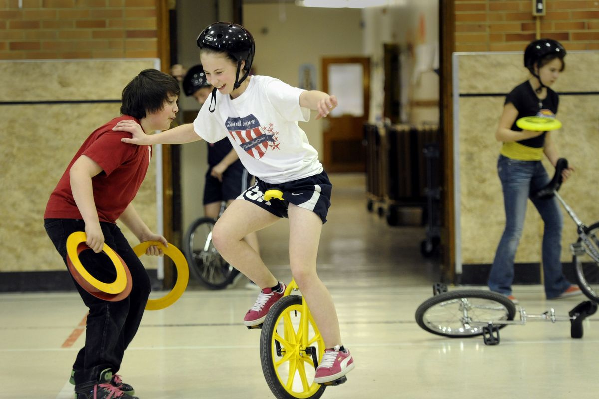 Jaeden Sandstrom, 12, works on her unicycle skills March 21 during a gathering of the circus club at Finch Elementary School in Spokane. Unicycling, juggling, stilt walking and gymnastics are among the skills learned in the after-school program. (Jesse Tinsley)