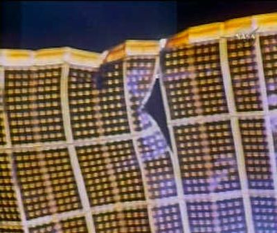 
In this image from NASA TV, a view of the damage to a solar panel on the International Space Station can be seen Tuesday. Associated Press
 (Associated Press / The Spokesman-Review)