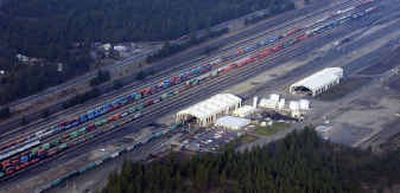 
This is an aerial view of the Burlington Northern Santa Fe refueling depot west of Rathdrum, Idaho. Excavation was done near the cylindrical white tanks, which hold diesel fuel for train locomotives, to find the extent of a leak from a broken wastewater pipe.
 (Jesse Tinsley / The Spokesman-Review)