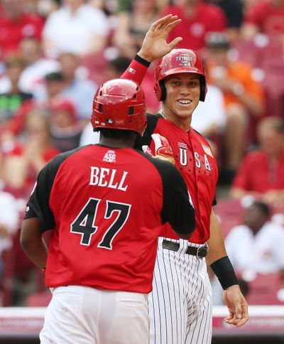 United States' Aaron Judge congratulates Josh Bell after Bell hit a two-run home run. (Associated Press)